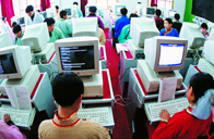 Middle school students of the Dahaner ethnic group attending computer class.